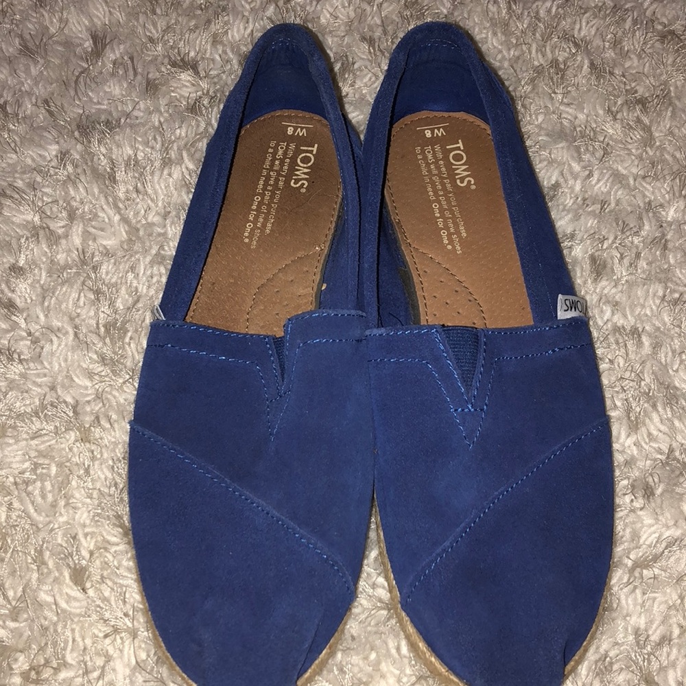 Never worn blue suede Toms